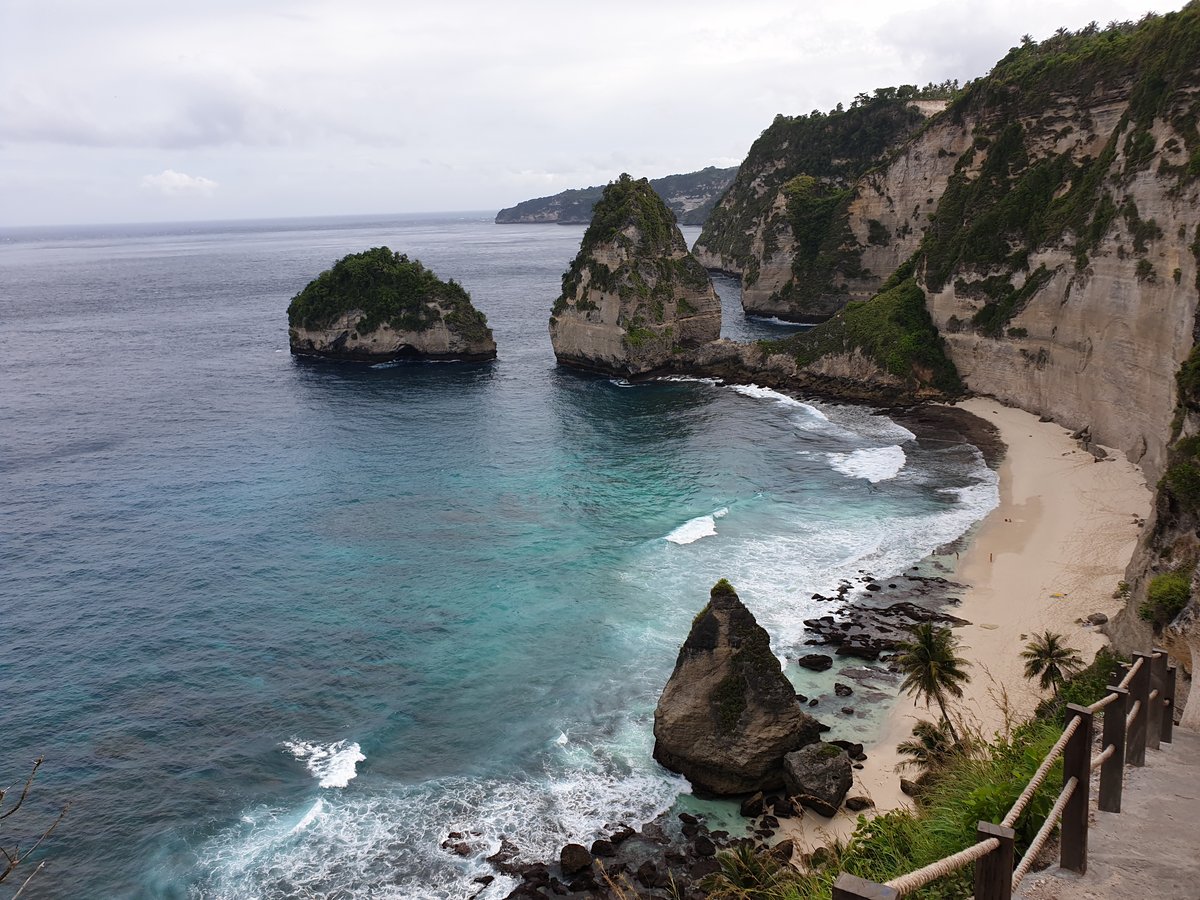 Thousand Islands viewpoint on Nusa Penida with green limestone islets in clear blue sea