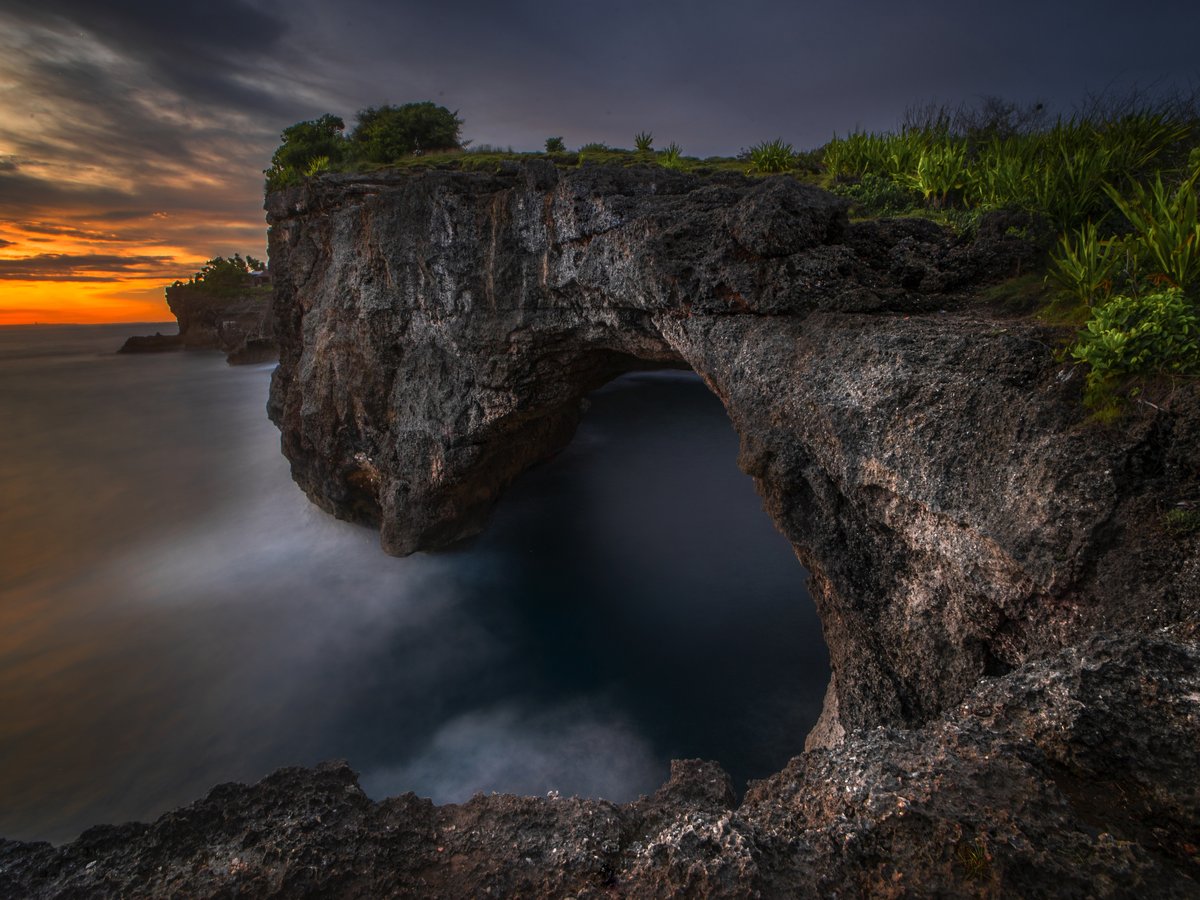 Broken Beach Pasih Uug circular cliff bay with natural sea arch tunnel on Nusa Penida