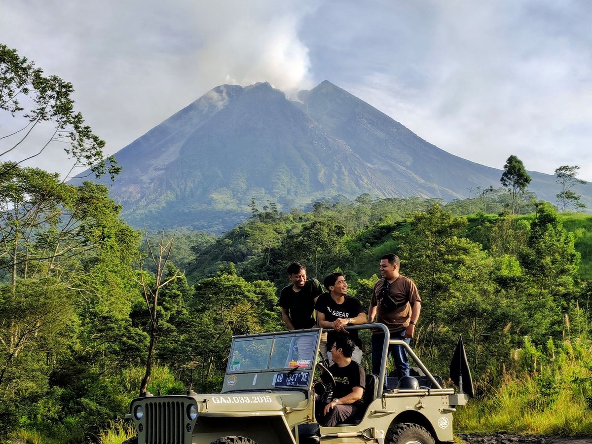 Open top 4WD jeep on the black lava field of Mount Batur at sunrise in Kintamani Bali