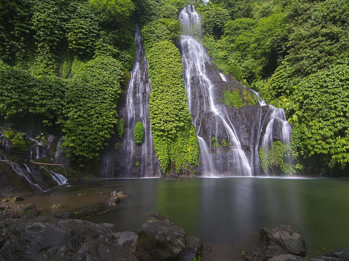 Banyumala twin waterfall in north Bali with two cascades and a turquoise swimming pool